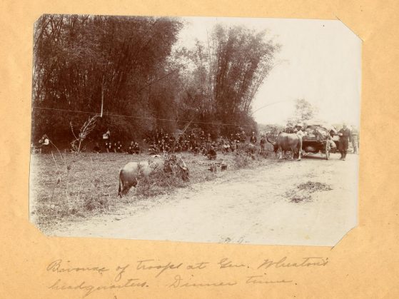 Bivouac of troops at General Wheaton's headquarters. Dinner time, ca. 1900 (No. 13) Philippines (Phillipines photo mounted onlarger sheet with inscription)